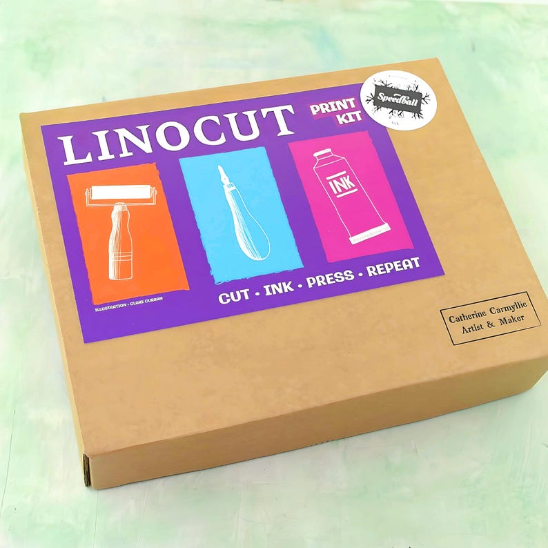 Kraft eco box with product label in bright colours saying Linocut kit alos a caption ...cut.ink.press.repeat