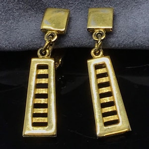 Gold earrings Signed Trifari clipon  ladder