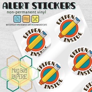 May include: Five round, white, non-permanent vinyl stickers with a cartoon illustration of an EpiPen. The stickers have a yellow circle with an orange outline, a blue circle inside the yellow circle, and a brown outline around the blue circle. The text "EPIPEN INSIDE" is printed in brown on the stickers.