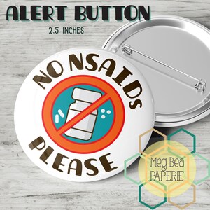 May include: A white button, 6.35 cm in diameter, with the text "NO NSAIDS PLEASE" in brown. The button features a red circle with a line through a pill bottle. The words "ALERT BUTTON" are at the top.