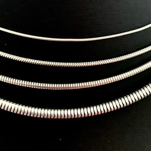 Snake Chain Necklace design in silver color made of 316L Stainless Steel.  Great wearing with no tarnishing. Nice for gift giving for Men or Women. Widths include 1mm, 1.5mm, 2.4mm and 4mm.