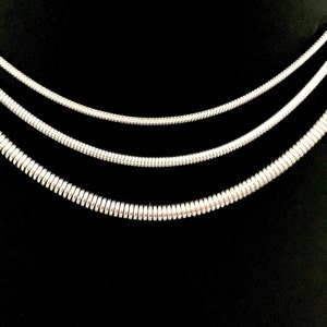 Snake Chain Necklace design in silver color made of 316L Stainless Steel.  Great wearing with no tarnishing. Nice for gift giving for Men or Women. Widths include 1mm, 1.5mm, 2.4mm and 4mm.