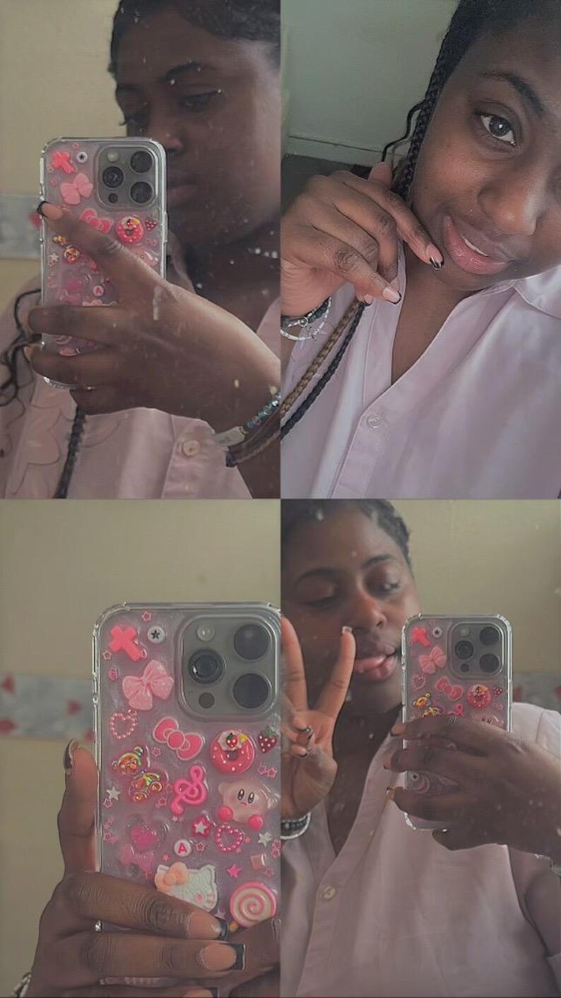 May include: Clear phone case decorated with pink bows, hearts, stars, and a Hello Kitty figure. The case is on a phone with multiple camera lenses. The person in the image is wearing a pink shirt.