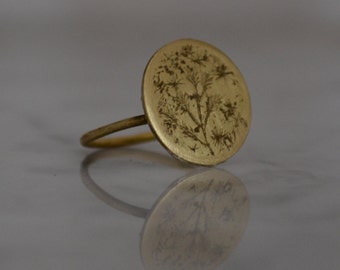 Brass ring with engraved medal