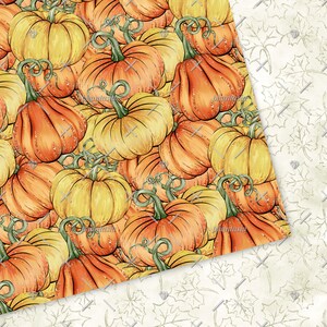 May include: A seamless pattern featuring a variety of orange and yellow pumpkins with green stems. The pumpkins are arranged in a random pattern and are overlapping each other. The background is a white, textured surface.