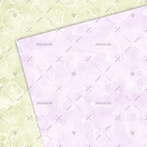 May include: A seamless pattern featuring white butterflies on a light purple background. The butterflies are drawn in a delicate, watercolour style and are scattered randomly across the surface. The background is a soft, pastel purple with a subtle watercolour texture.