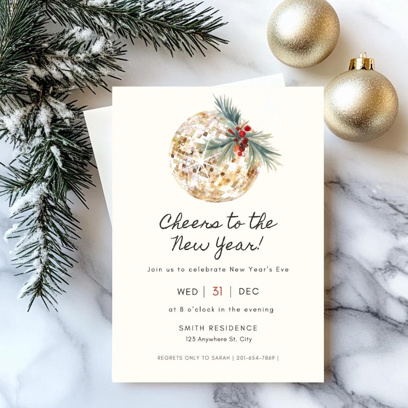 May include: New Year's Eve invitation card with a gold glitter ball illustration, text "Cheers to the New Year!", date, time, and address. The card is on a marble surface with pine branches and gold ornaments.