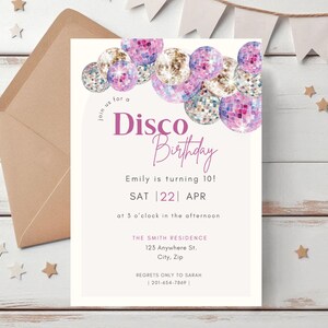 May include: A white invitation with a pink and purple disco ball design. The text reads "Join us for a Disco Birthday". The invitation is for Emily's 10th birthday party on Saturday, April 22nd at 3 o'clock in the afternoon. The address is The Smith Residence, 123 Anywhere St., City, Zip. The RSVP information is "Regrets only to Sarah | 201-654-7869 |"