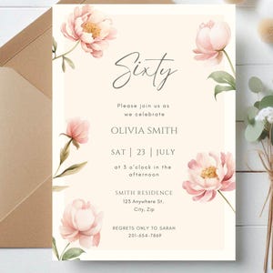 May include: A floral invitation with the word "Sixty" in elegant script. The invitation includes details for Olivia Smith's celebration on July 23rd at 3 p.m. Pink peony illustrations and a kraft paper envelope complete the design.