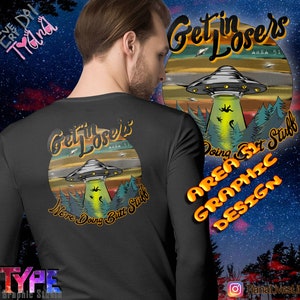 May include: A black long-sleeve shirt with a graphic design of a UFO and the text "Get in Losers Area 51 We're Doing Butt Stuff" in a retro style. The shirt also features a graphic design of a forest and the text "Area 51 Art Stuff Graphic Design".