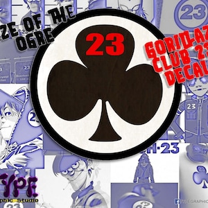 May include: A black and white graphic of a clover with the number 23 in red inside. The text "Gorillaz Club 23 Decal" is in white with a black outline. The text "Rize of the Ogre" is in white with a black outline. The text "Type Graphic Studio" is in white with a black outline.