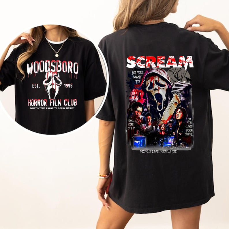 May include: Black t-shirt featuring a graphic from the movie Scream. The back of the shirt has a Scream movie poster design with the text "Scream" and "Do you like scary movies?" The front has a Woodsboro Horror Film Club design.