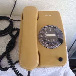 Vintage rotary dial telephone SIEMENS  ( Dark yellow-mustard color)