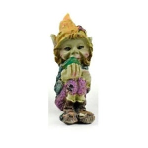 May include: A small green and brown gnome figurine with a yellow hat and purple pants. The gnome is holding a green leaf in its hands and has a mischievous expression on its face.