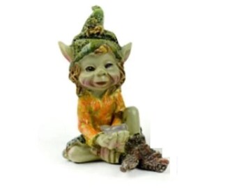 Miniature Pixie Holding a  Stone Figurine