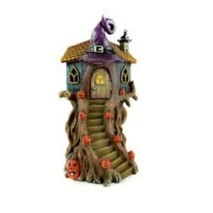 May include: A whimsical Halloween tree house with a purple witch's hat on top, a wooden door, and a staircase leading up to the entrance. The tree trunk is decorated with carved pumpkins.