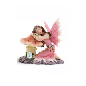 Pink Glitter Fairy Resting on a Mushroom