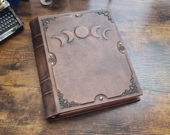 Moon phases leather 3-ring binder by Velimira.  Aged pages,  letter size