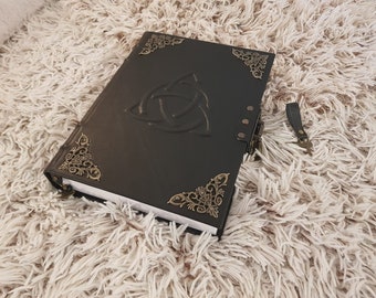 big spellbook charmed grimoire triquetra