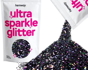 May include: A bag of black iridescent glitter labeled "hemway ultra sparkle glitter" with the words "Extra Chunky" printed below. The bag is being poured out, showing a pile of the glitter.