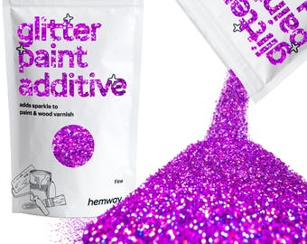 May include: A white resealable pouch with the text "glitter paint additive" and "adds sparkle to paint & wood varnish" printed on it. The pouch is open and pouring out fine purple glitter onto a white surface. The text "Fine" and "hemway" are printed on the pouch.
