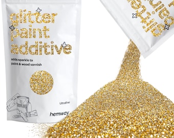 May include: A bag of gold glitter paint additive, labeled "glitter paint additive" and "adds sparkle to paint & wood varnish". The bag is open and pouring out the glitter, which is a fine, sparkly gold color.
