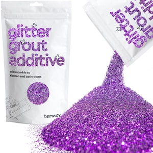 May include: Purple glitter grout additive in a white resealable bag with the text "glitter grout additive" and "adds sparkle to kitchen and bathrooms". The bag is pouring out the glitter onto a white surface.