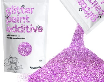 May include: A bag of fine pink glitter paint additive. The bag is labeled "glitter paint additive" and "adds sparkle to paint & wood varnish". The bag is open and the glitter is pouring out.