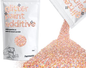 May include: A bag of fine glitter paint additive, labeled "glitter paint additive" and "adds sparkle to paint & wood varnish". The bag is open and pouring out pink glitter onto a white background.