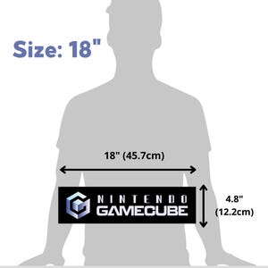May include: A black and white Nintendo GameCube logo on a black rectangle with white text. The rectangle is 18 inches wide and 4.8 inches tall.
