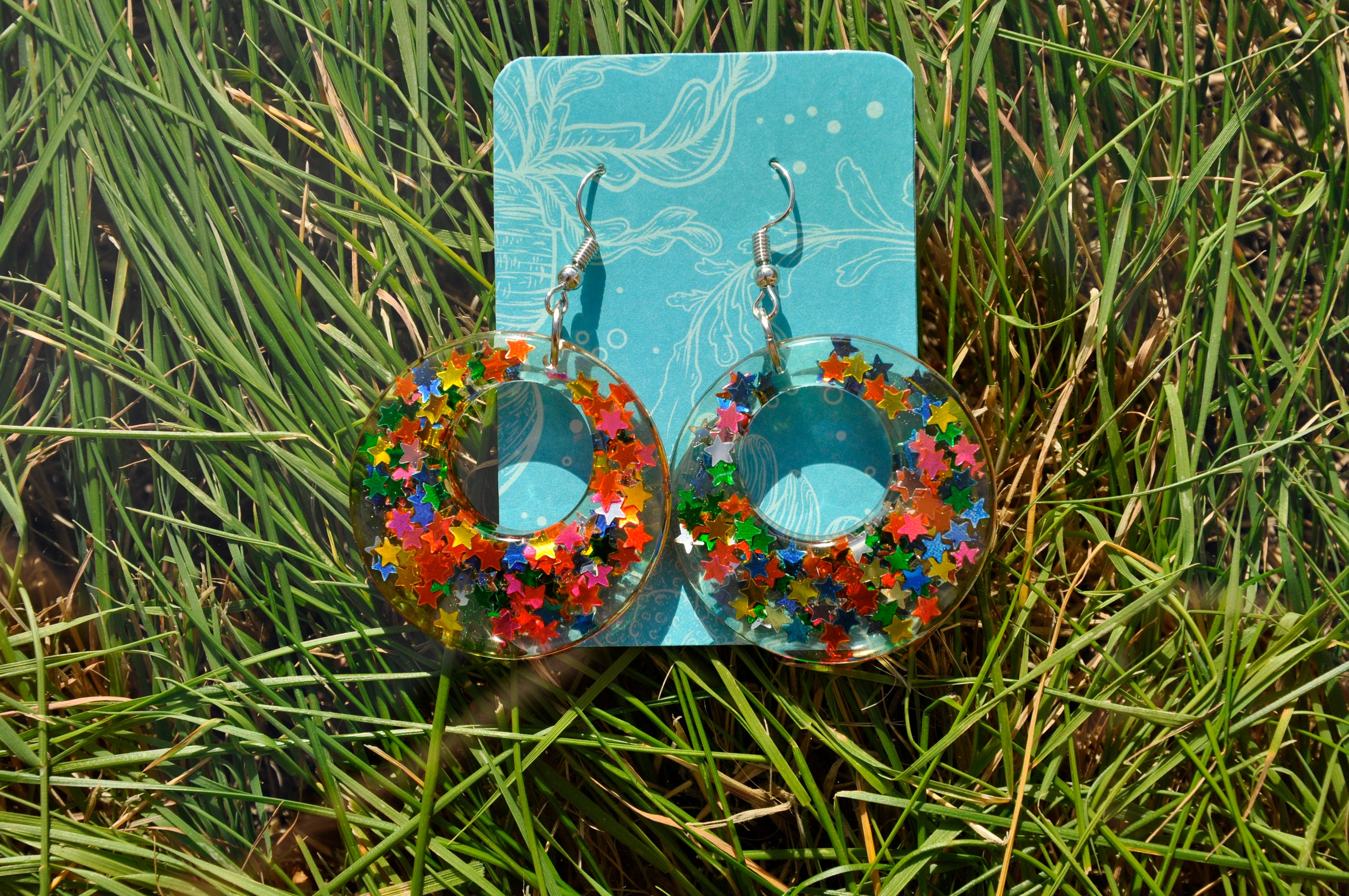 Clear epoxy resin earrings with multicoloured stars encased Etsy