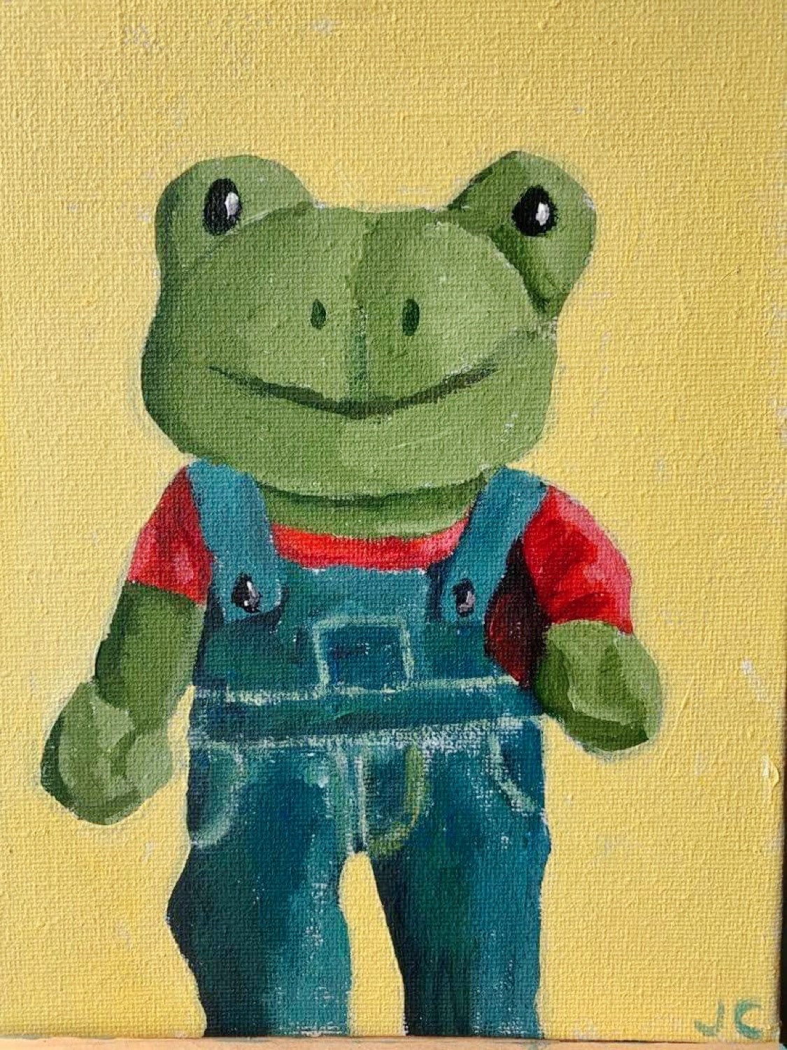 stuffed frog with overalls