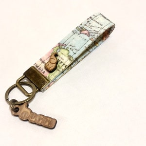 Llavero de mapa. Llavero del mapa del mundo. Mapa Key Fob. Llavero de agente de viajes.
