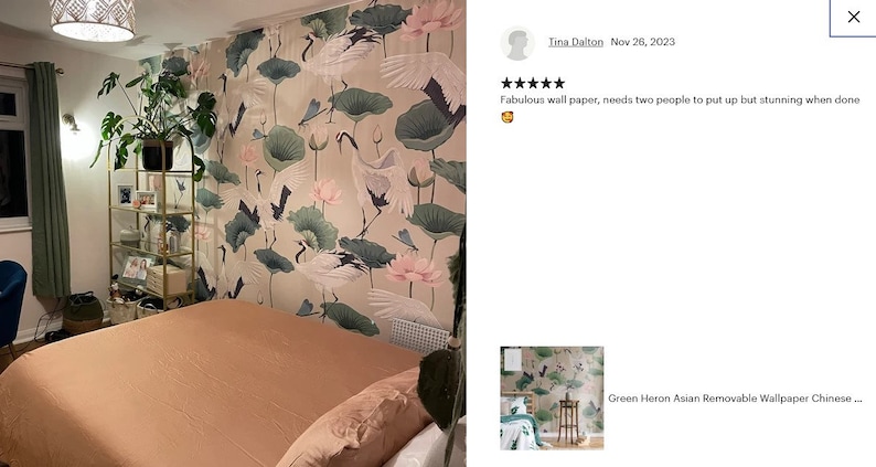 May include: A bedroom with a peach-colored bedspread and a wall covered in a removable wallpaper featuring a green heron, lotus flowers, and dragonfly designs. The text "Green Heron Asian Removable Wallpaper Chinese..." is visible in the lower right corner of the image.