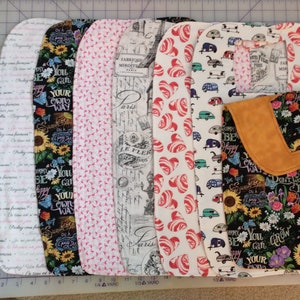 May include: Eight fabric panels with different patterns, including hearts, flowers, and text. The panels are all approximately 18 inches long and 6 inches wide. The text on the panels includes "You can grow your own way", "Don't worry be happy", and "Paris".
