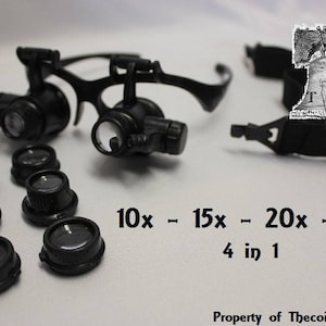 Puede incluir: Gafas lupa negras con lentes intercambiables, que ofrecen aumentos de 10x, 15x, 20x y 25x. Incluye múltiples lentes y una montura. El texto en la imagen dice "4 en 1".