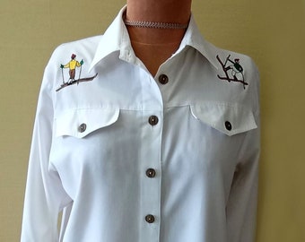 Vintage white women's shirt with embroidered Skiers winter ornamentation