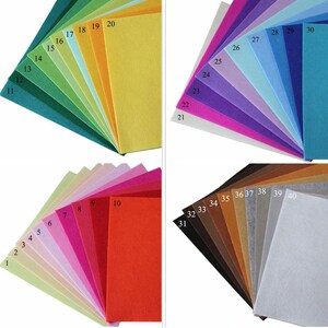 May include: A set of 40 felt sheets in various colors, numbered 1 through 40. The felt sheets are arranged in rows, with each row containing a different color.
