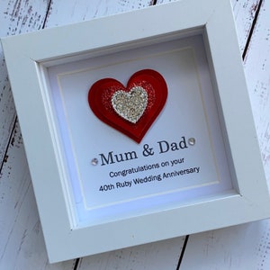 May include: White framed picture with a red layered heart with silver glitter. The text reads "Mum & Dad. Congratulations on your 40th Ruby Wedding Anniversary."