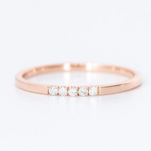 minimal thin diamond wedding band with 5 small diamonds