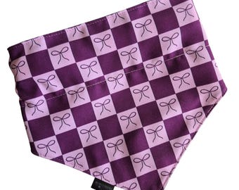 Purple Checkered Bows pattern slip on dog bandana, stain resistant pattern, waterproof and wipe clean backing, top stitched