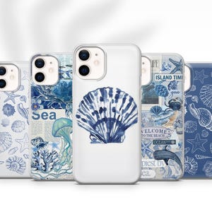 May include: Five white phone cases with marine-themed designs. The cases display illustrations of seashells, starfish, and marine life in blue hues. One case features a large blue seashell design.