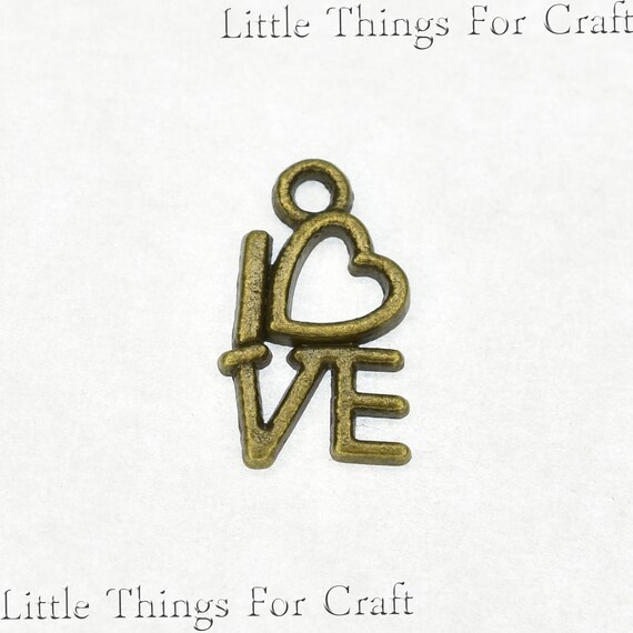 10 Flower charms antique bronze tone BC64