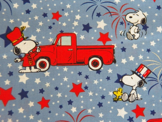 Snoopy with Woodstock Patriotic Fabric with Red Pickup Trucks, Red/White Blue Fireworks and Stars, 100% Cotton Fabric from Springs Creative