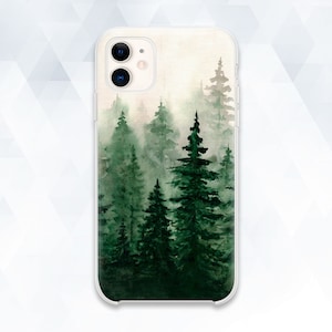 May include: A phone case featuring a watercolour design of a forest with green trees and a misty background.