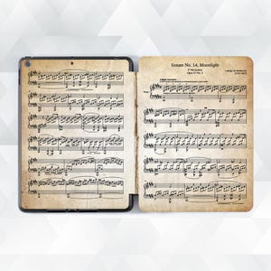 May include: A black and white printed sheet music book with the title "Sonate No. 14, Moonlight" by Ludwig van Beethoven (1770-1827). The first movement is "Adagio sostenuto" and the music is for piano.