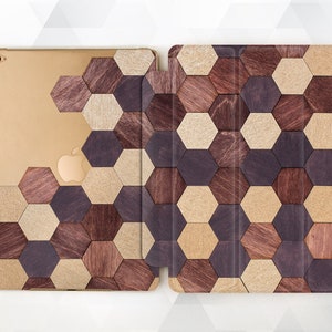 May include: A brown, black, and beige geometric iPad case with a honeycomb pattern.