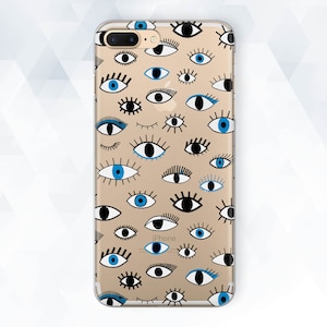 May include: A clear phone case with a pattern of blue and black eyes. The case is designed for an iPhone.