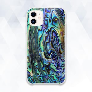 May include: A clear phone case with a colorful iridescent pattern. The pattern resembles a seashell with shades of blue, green, and purple.