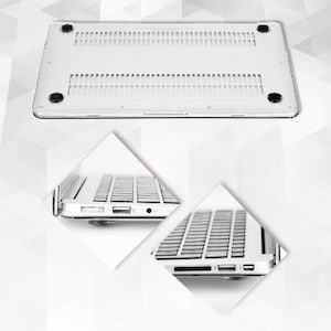 May include: A silver laptop computer, shown from multiple angles. The bottom view shows ventilation slots and four black rubber feet. Side views reveal ports, including USB and audio jacks. The keyboard is visible in the side views.